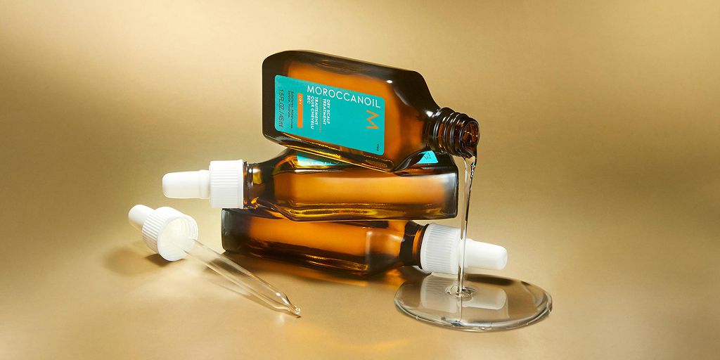 שלושה בקבוקוני טיפול לקרקפת של moroccanoil